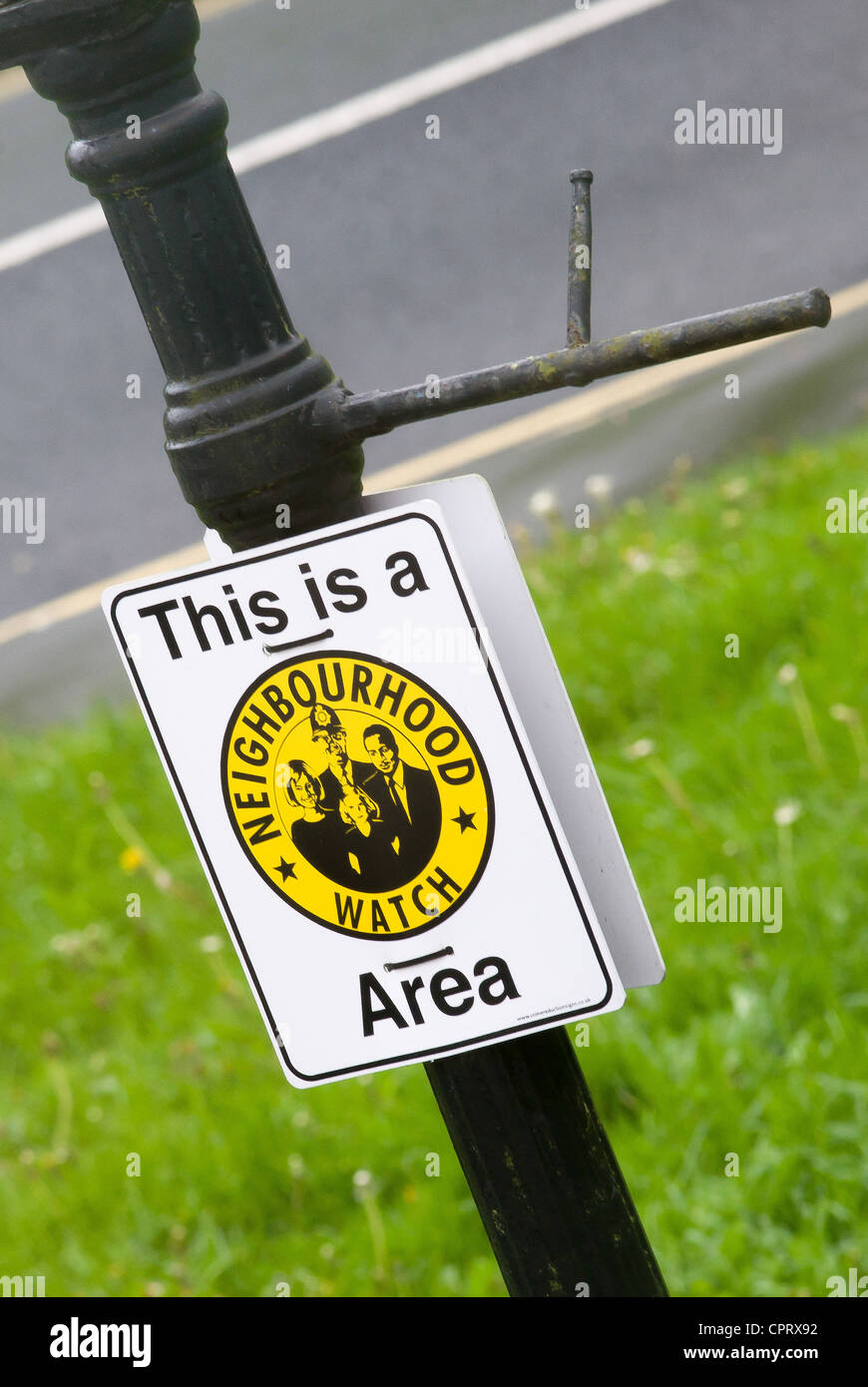 Neighbourhood Watch Area sign attached to an antique Victorian gas lamp post in Bristol UK Stock Photo