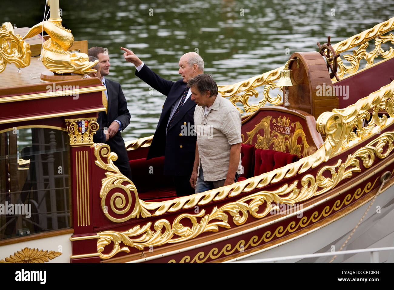 Lord Sterling of Plaistow (left) & boatbuilder Mark Edwards (right) looking over the Queen's Royal Barge 'Gloriana'. Richmond UK Stock Photo