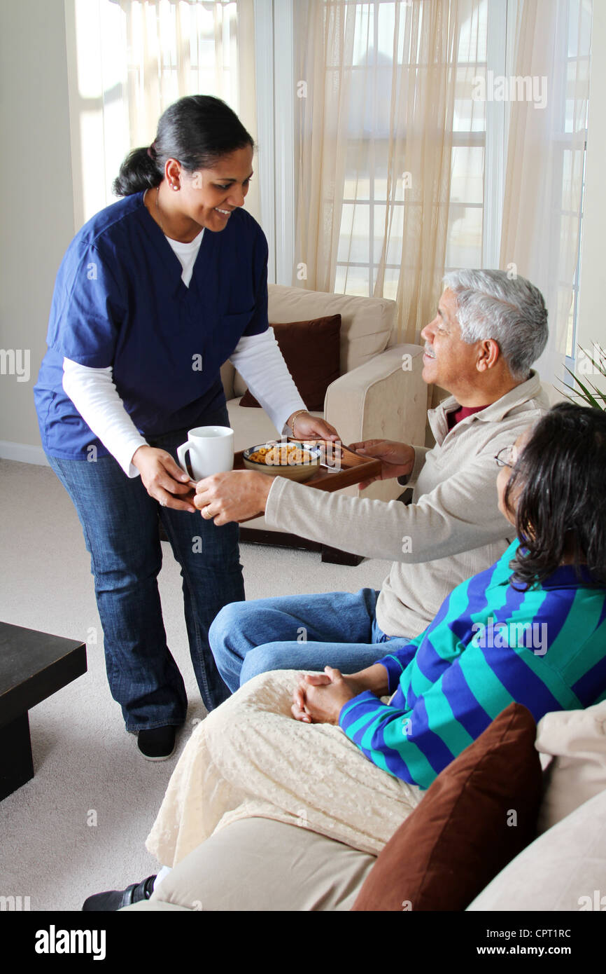 Home health care worker and an elderly couple Stock Photo Alamy