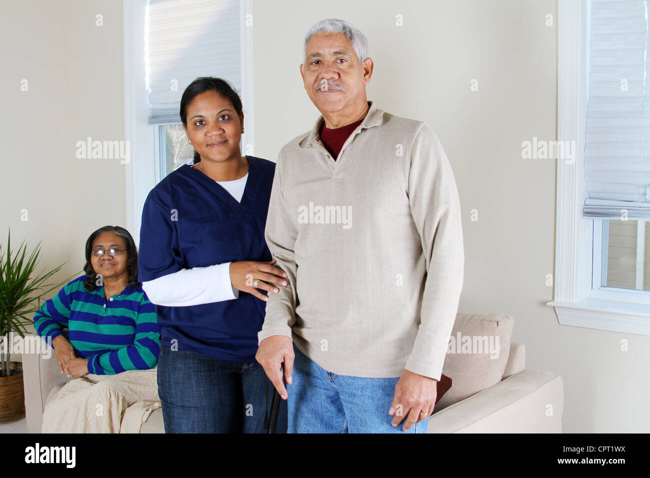 Home health care worker and an elderly couple Stock Photo