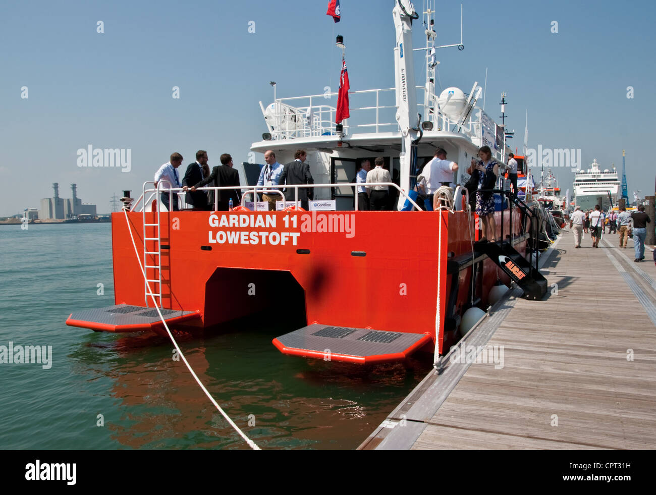 The stern of a large catamaran wokrboat in dock at Southampton. Stock Photo