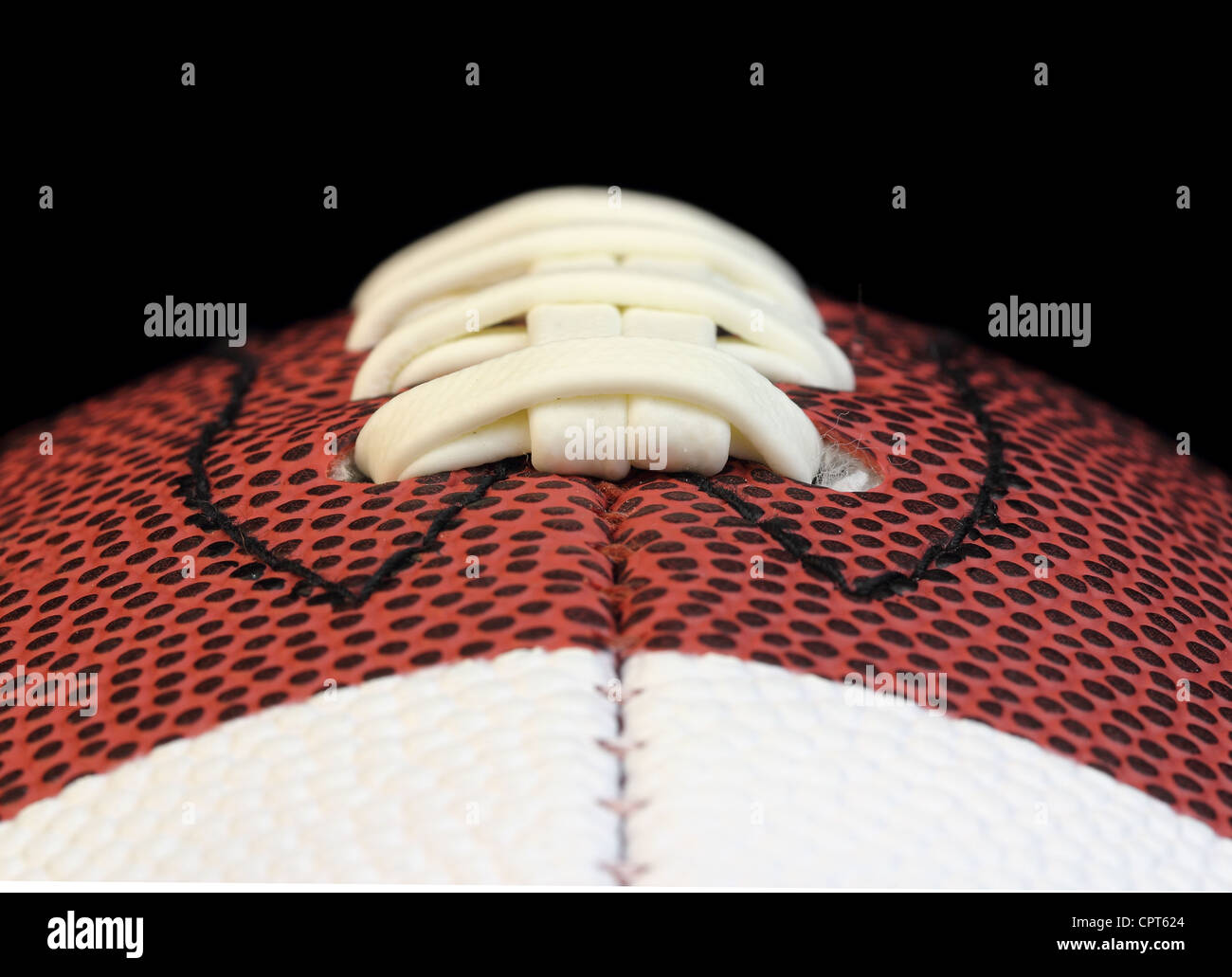Edge on macro of a football threads isolated on black Stock Photo Alamy