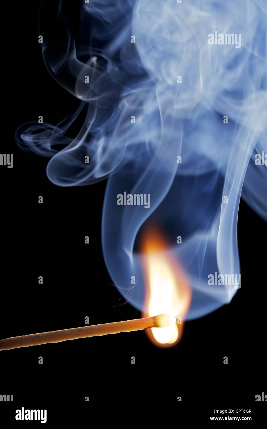 Burning match over a black background, with smoke Stock Photo - Alamy
