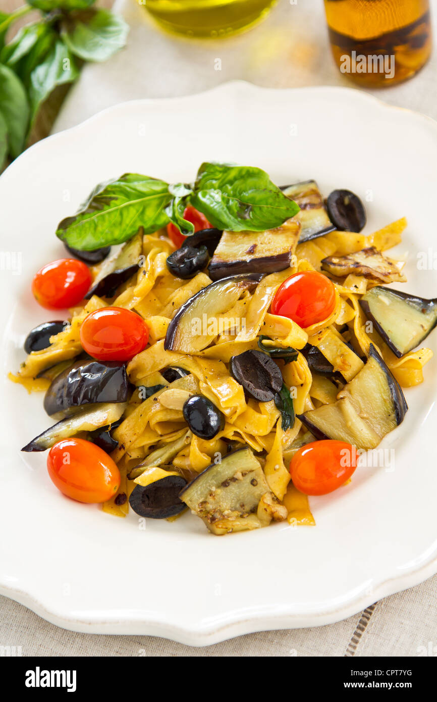Carrot Fettuccine with aubergine and olive Stock Photo