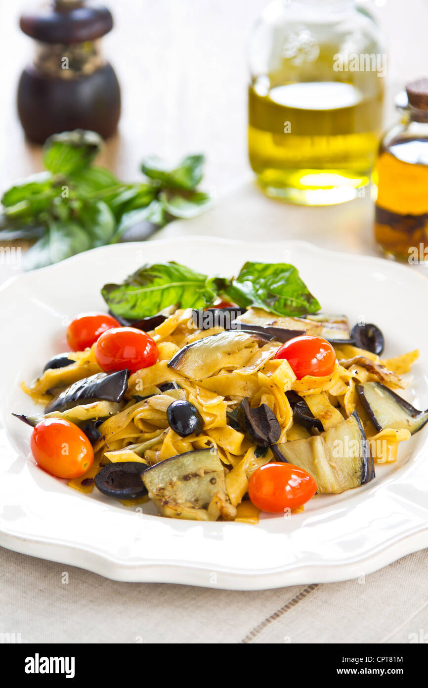 Carrot Fettuccine with aubergine and olive Stock Photo