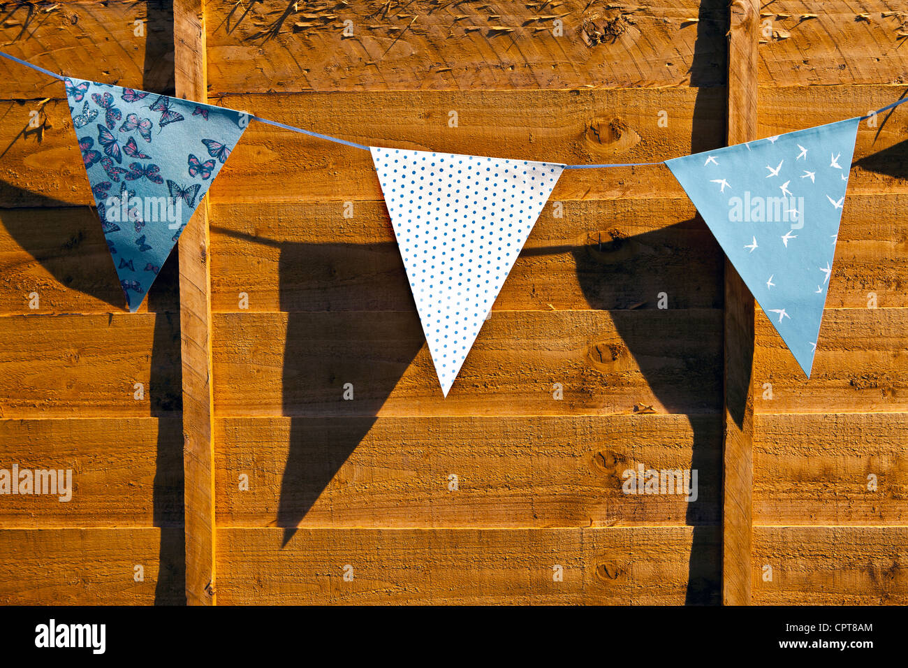 Bunting on garden fence Stock Photo - Alamy