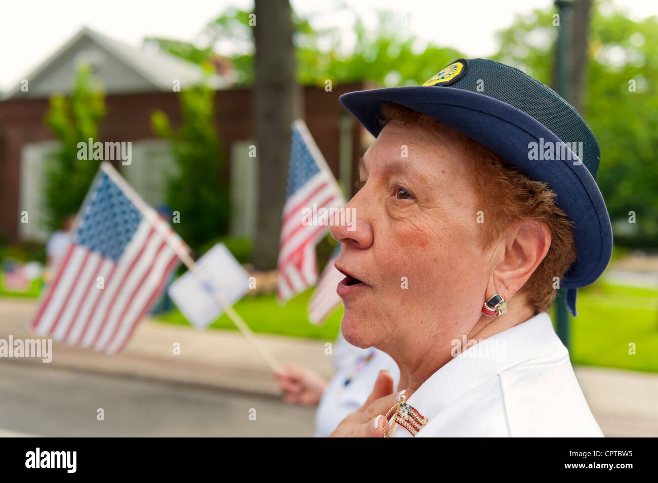 American Legion Auxiliary member marching in Merrick Memorial Day