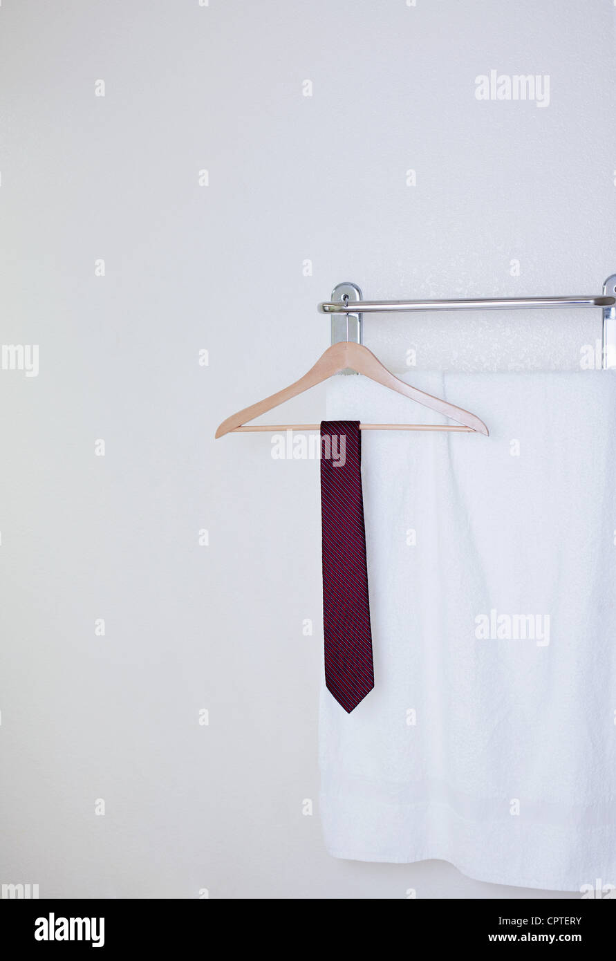 Tie on clothes hanger in hotel bathroom Stock Photo Alamy