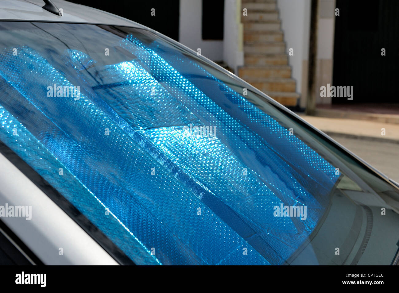sunshade inside the front windscreen of a car Stock Photo Alamy