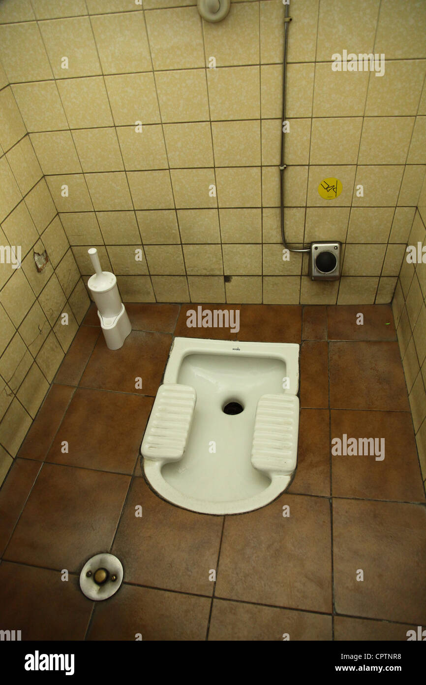 a stand up toilet in italy Stock Photo - Alamy