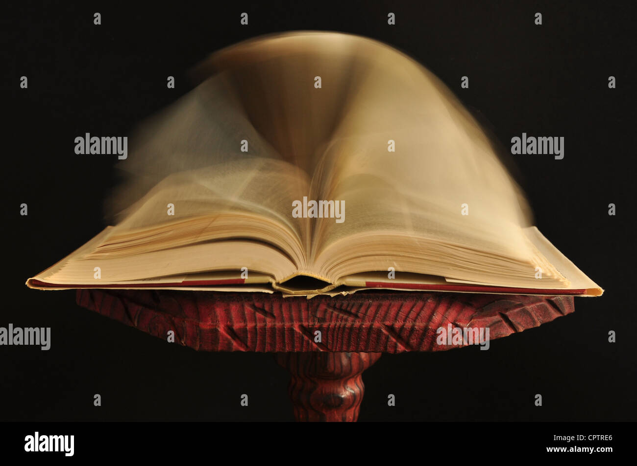 an old book on the wooden table, with a black background Stock Photo ...