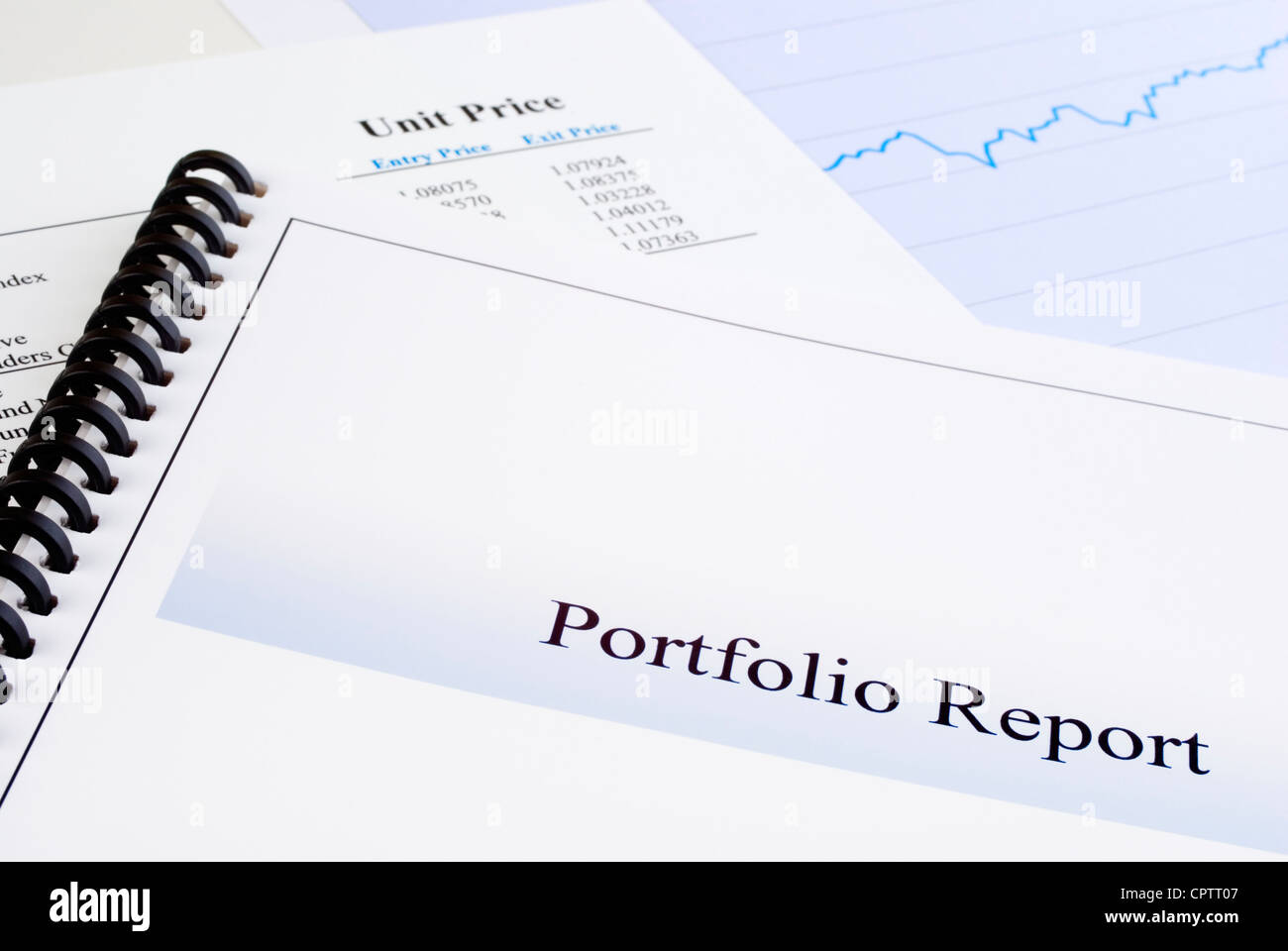 Portfolio Report, with unit trust information in background, and graph. Stock Photo