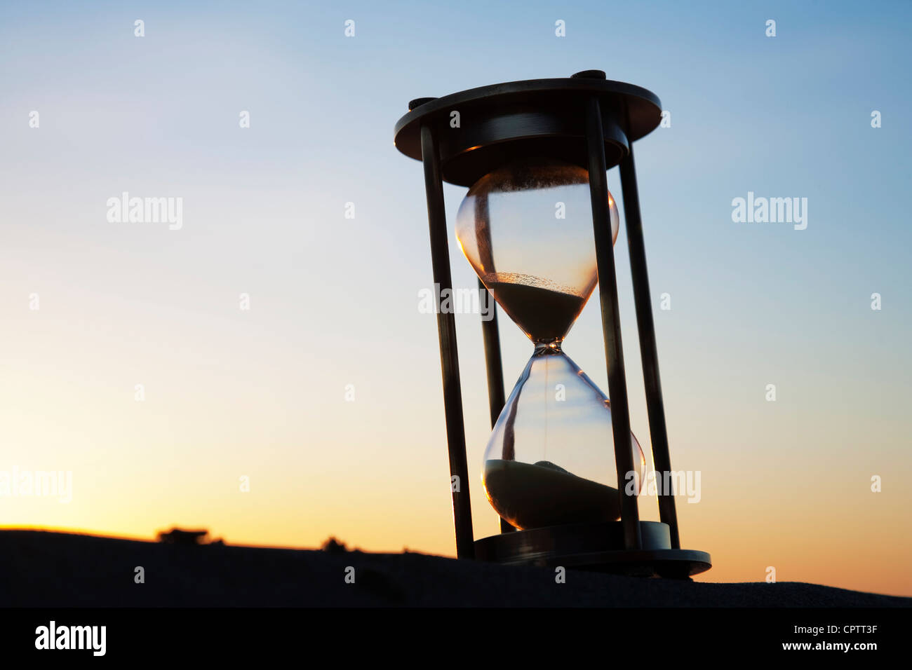 Hourglass from slightly below, outside at sunrise. Stock Photo