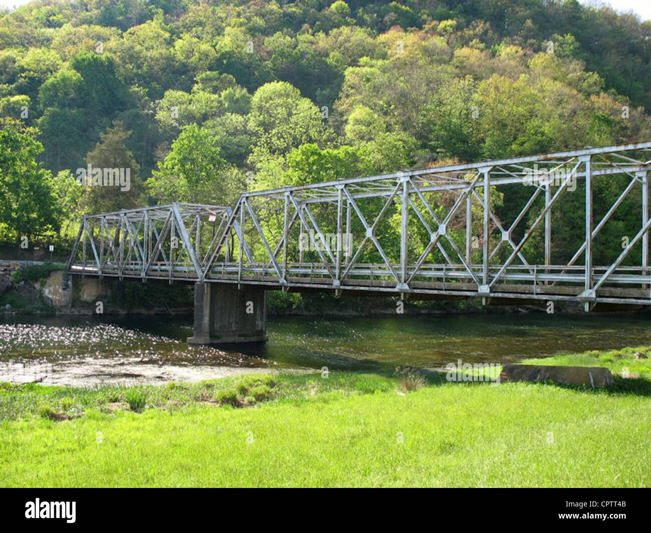 Old iron bridge over the Watauga River in Siam, Tennessee Stock Photo