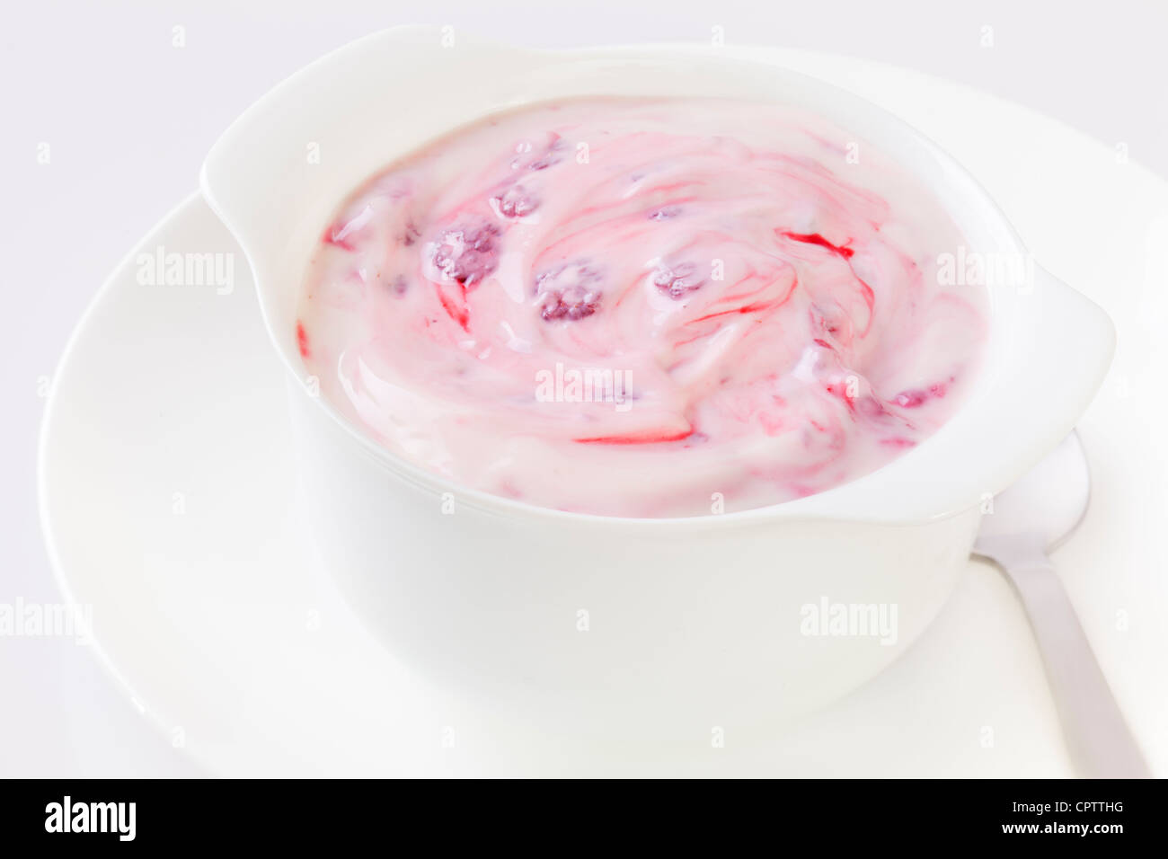 Raspberry yoghurt in a white bowl. Stock Photo