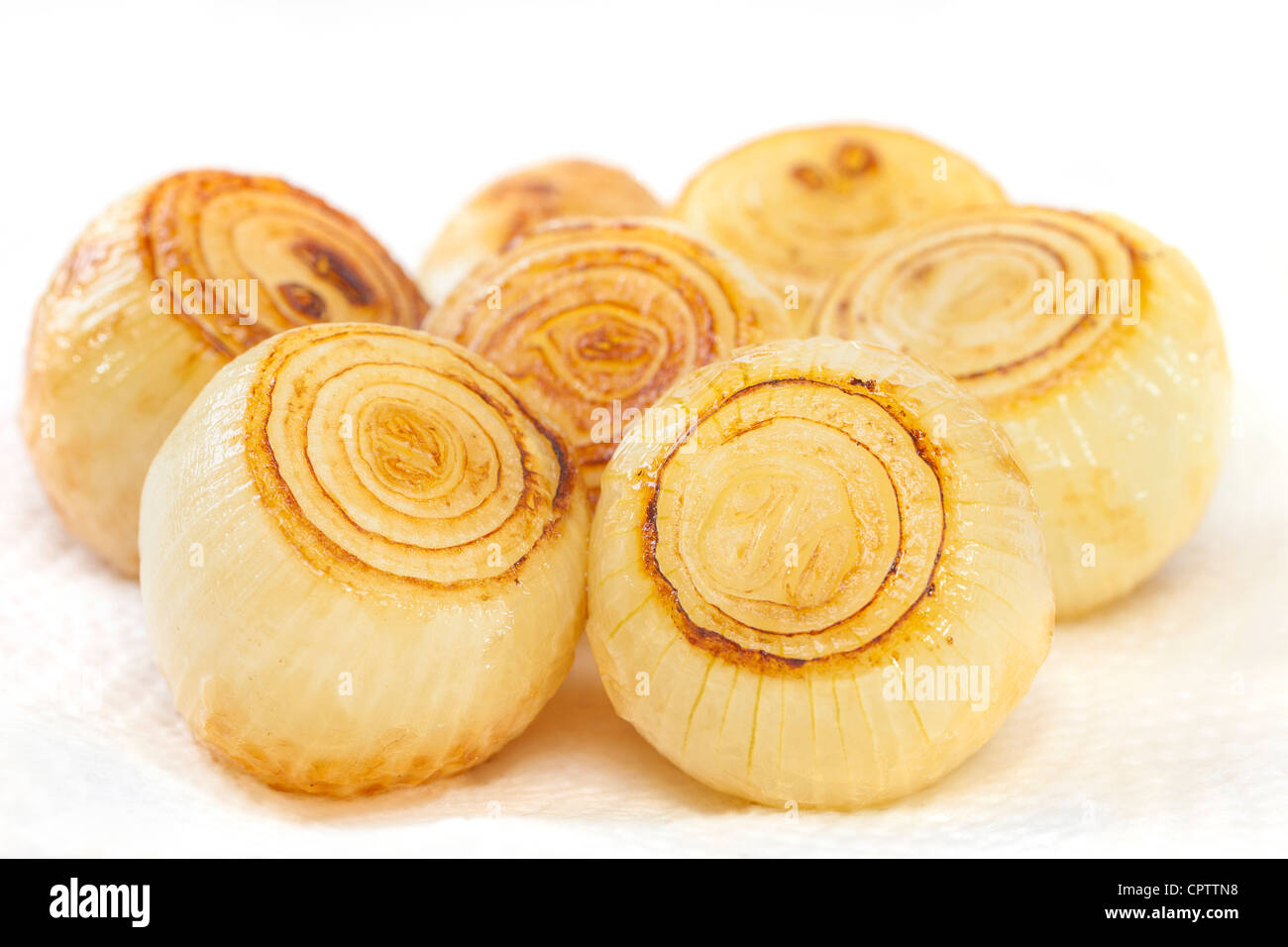 Roast onions on absorbent kitchen paper, Stock Photo