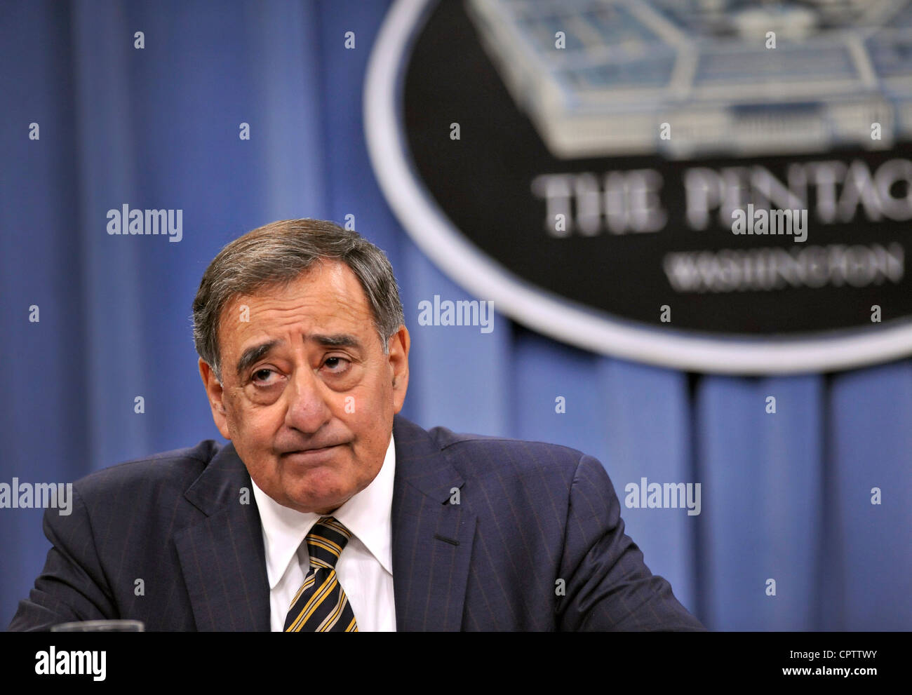 Secretary of Defense Leon E. listens to a question during a