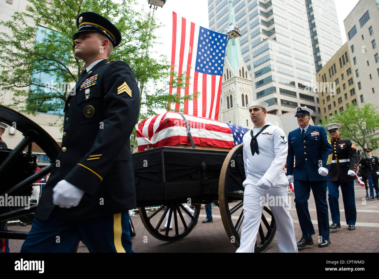An Indiana National Guardsman, Sailor, Coast Guardsman and Marine march