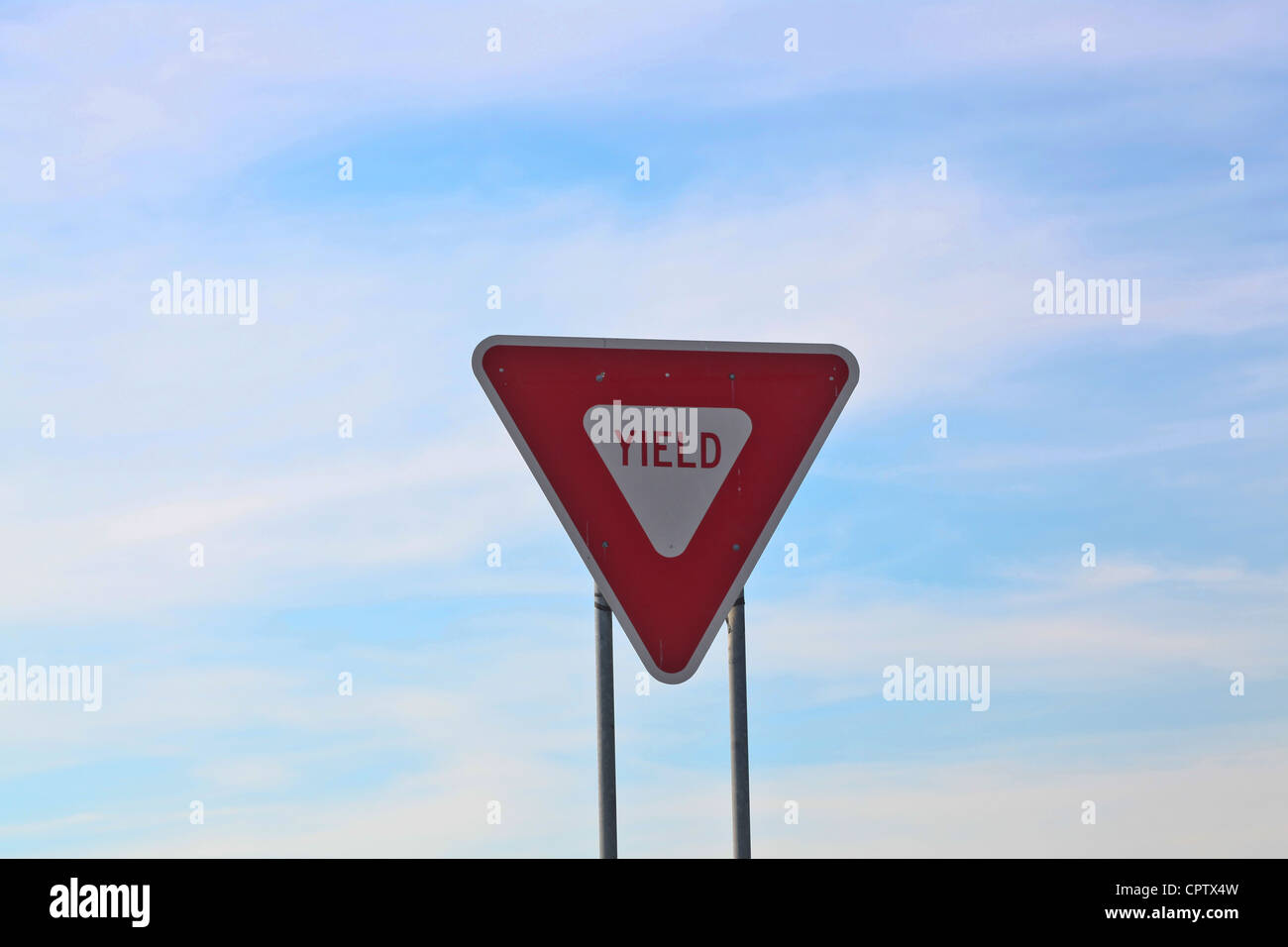 Yield sign along interstate highway Stock Photo
