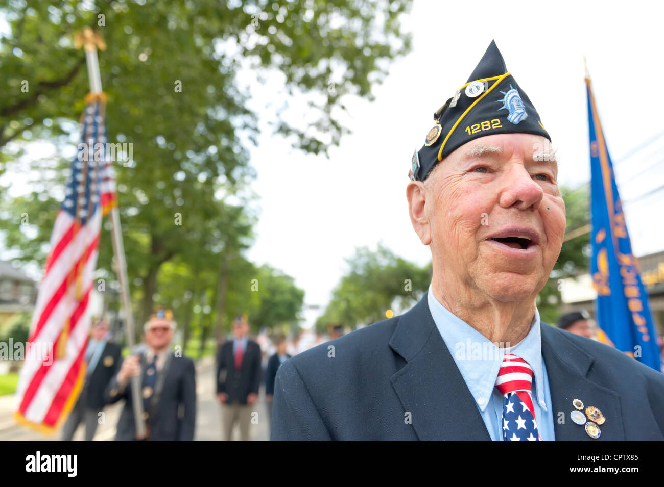 American Legion Commander marching in Merrick Memorial Day Parade on
