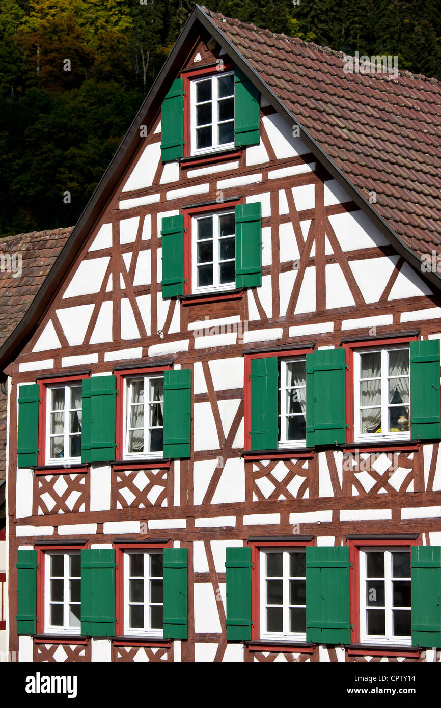 Windows and wooden shutters of quaint timberframed house in Schiltach