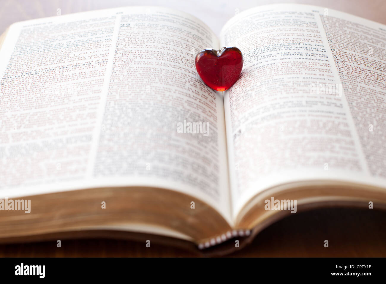 heart on a bible, love for god's word Stock Photo Alamy