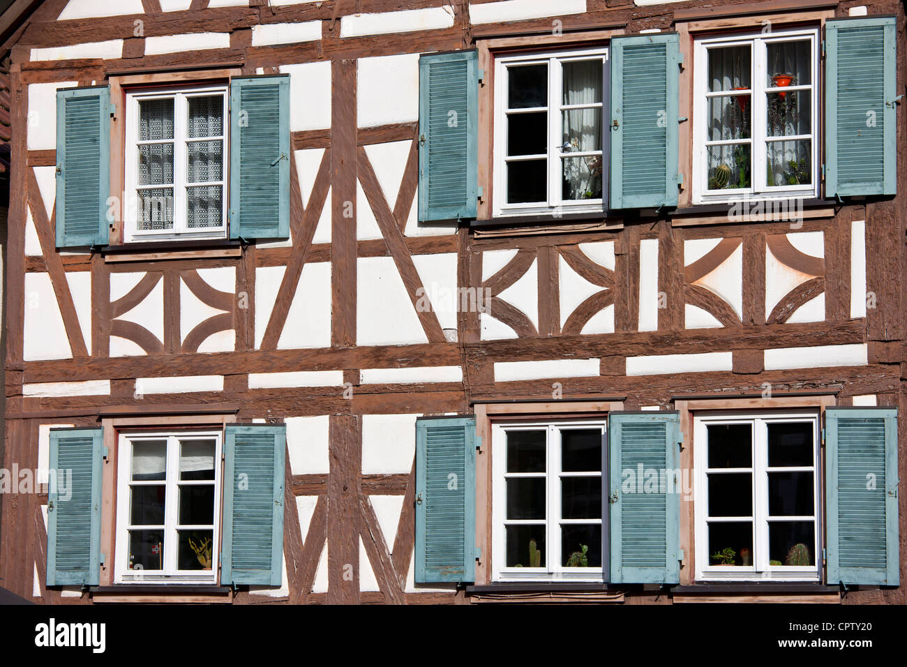 Windows and wooden shutters of quaint timberframed house in Schiltach