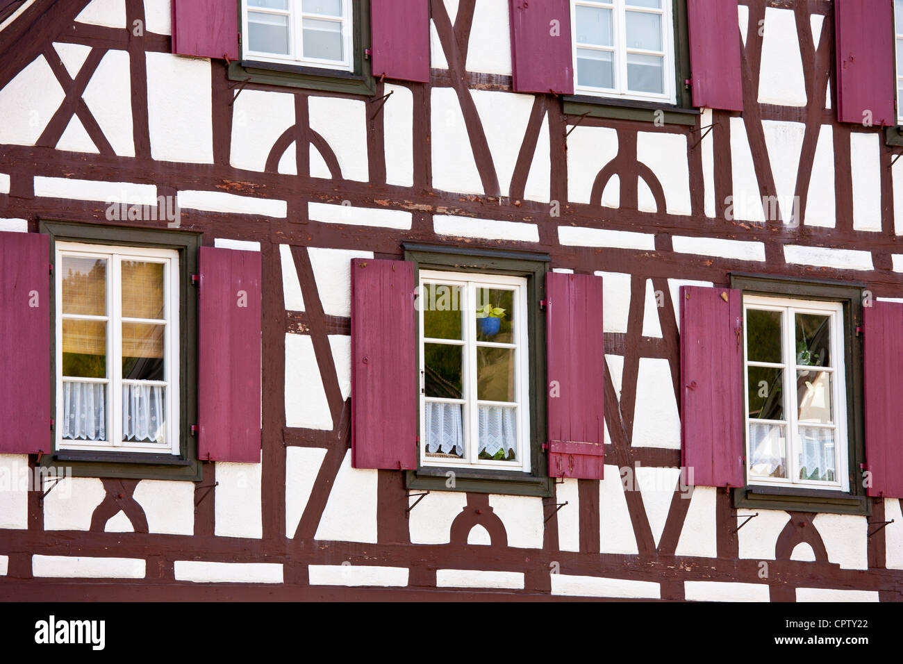 Windows and wooden shutters of quaint timberframed house in Schiltach