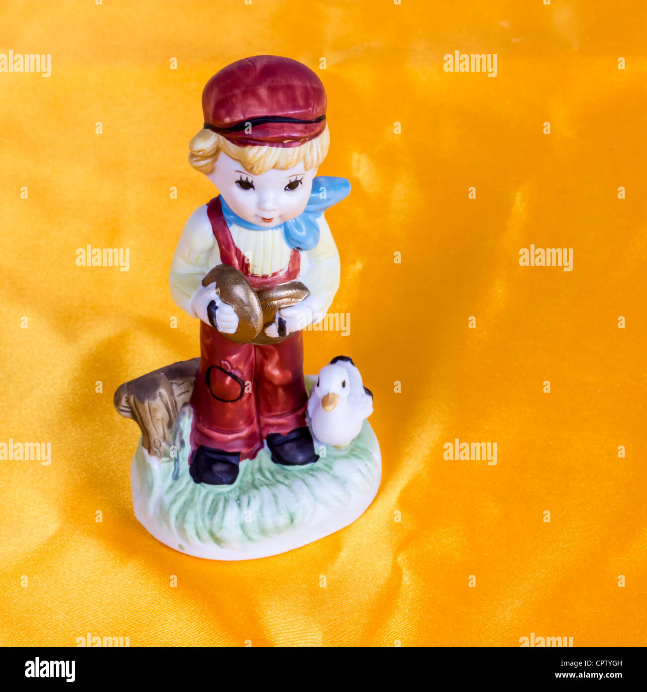 Porcelain figurine, Young Boy with Duck Stock Photo