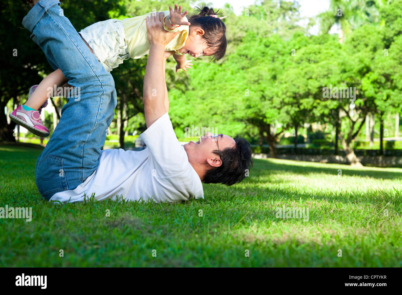 happy father and little girl on the grass Stock Photo