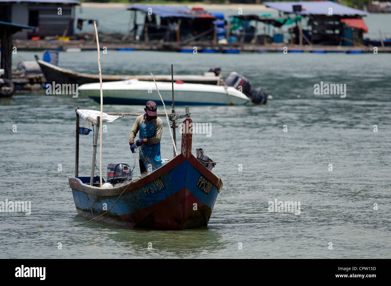 Fisherman in boat fishing hi-res stock photography and images - Alamy