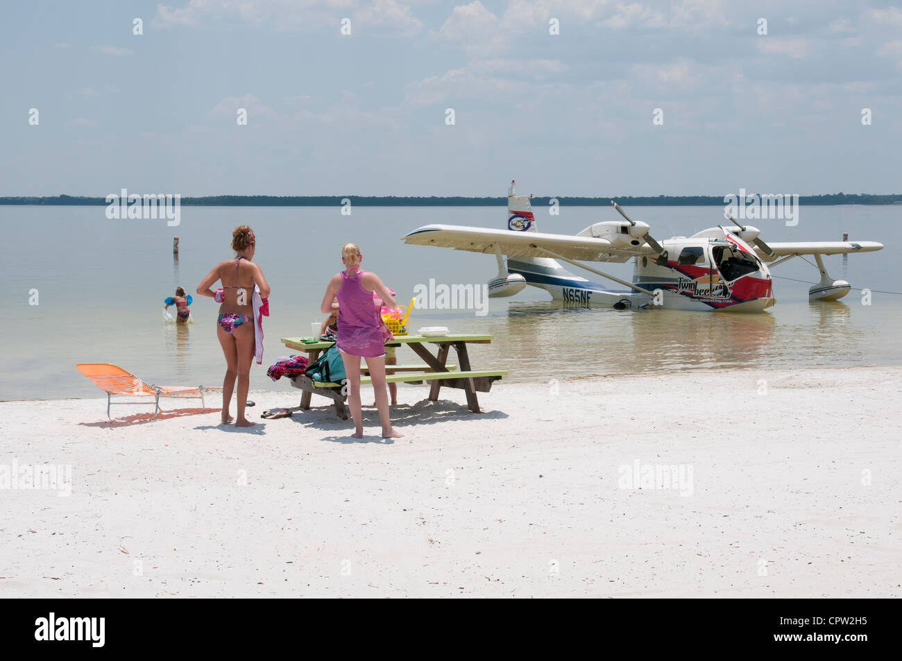 Seaplane & holidaymakers on the beach at Lake Weir Florida USA Stock