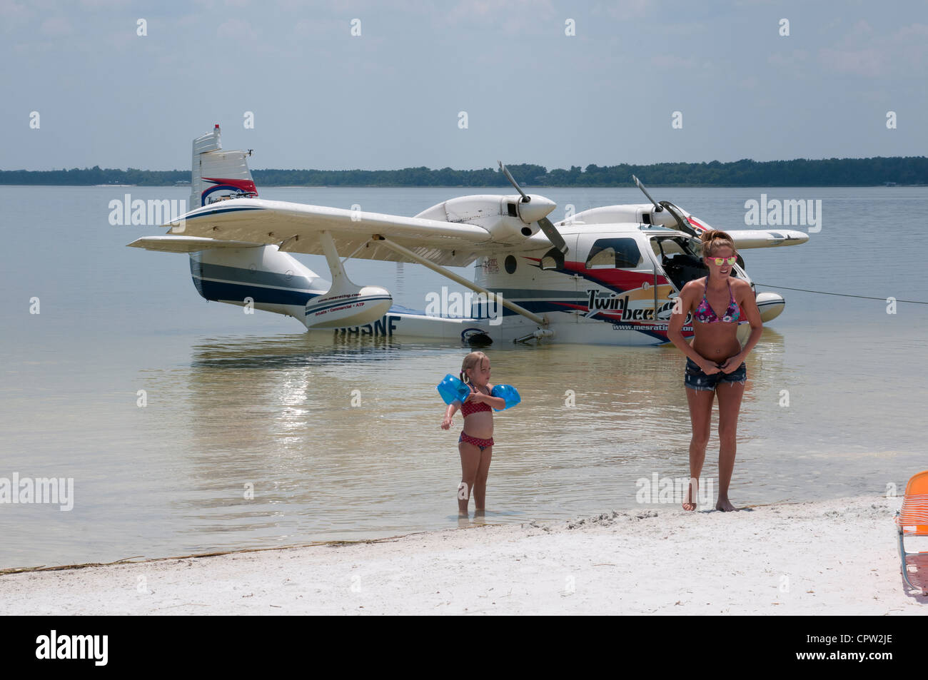 Seaplane & holidaymakers on the beach at Lake Weir Florida USA Stock