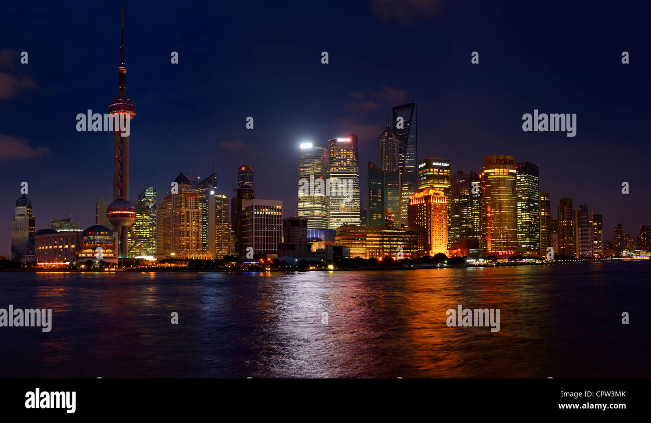 Twilight and night lights of Pudong east side high rise towers skyline of Shanghai Peoples Republic of China Stock Photo