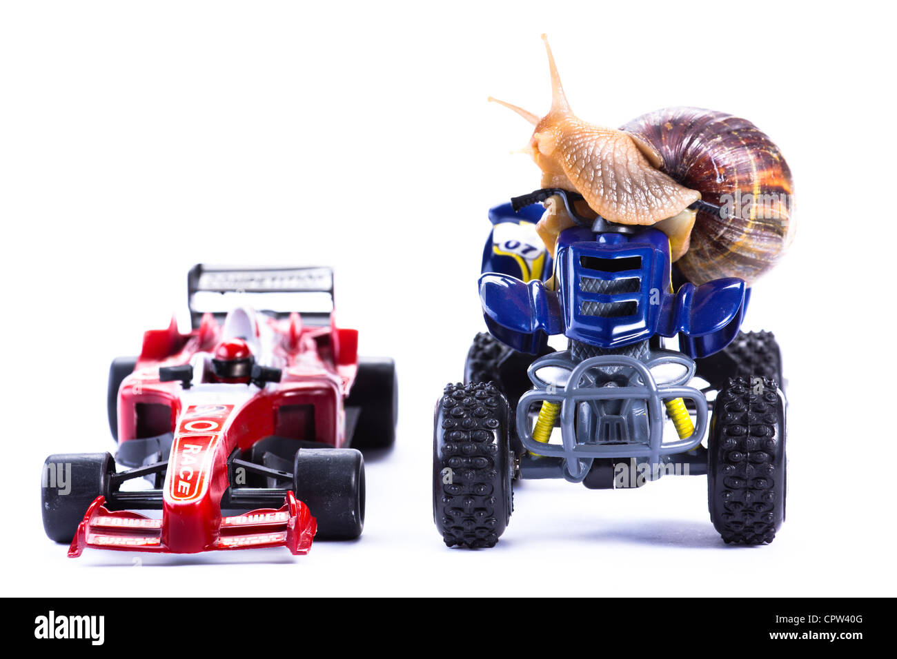 Animal Riding Formula 1 A snail riding a toy quad model looking at a Formula 1 Toy car Stock ...