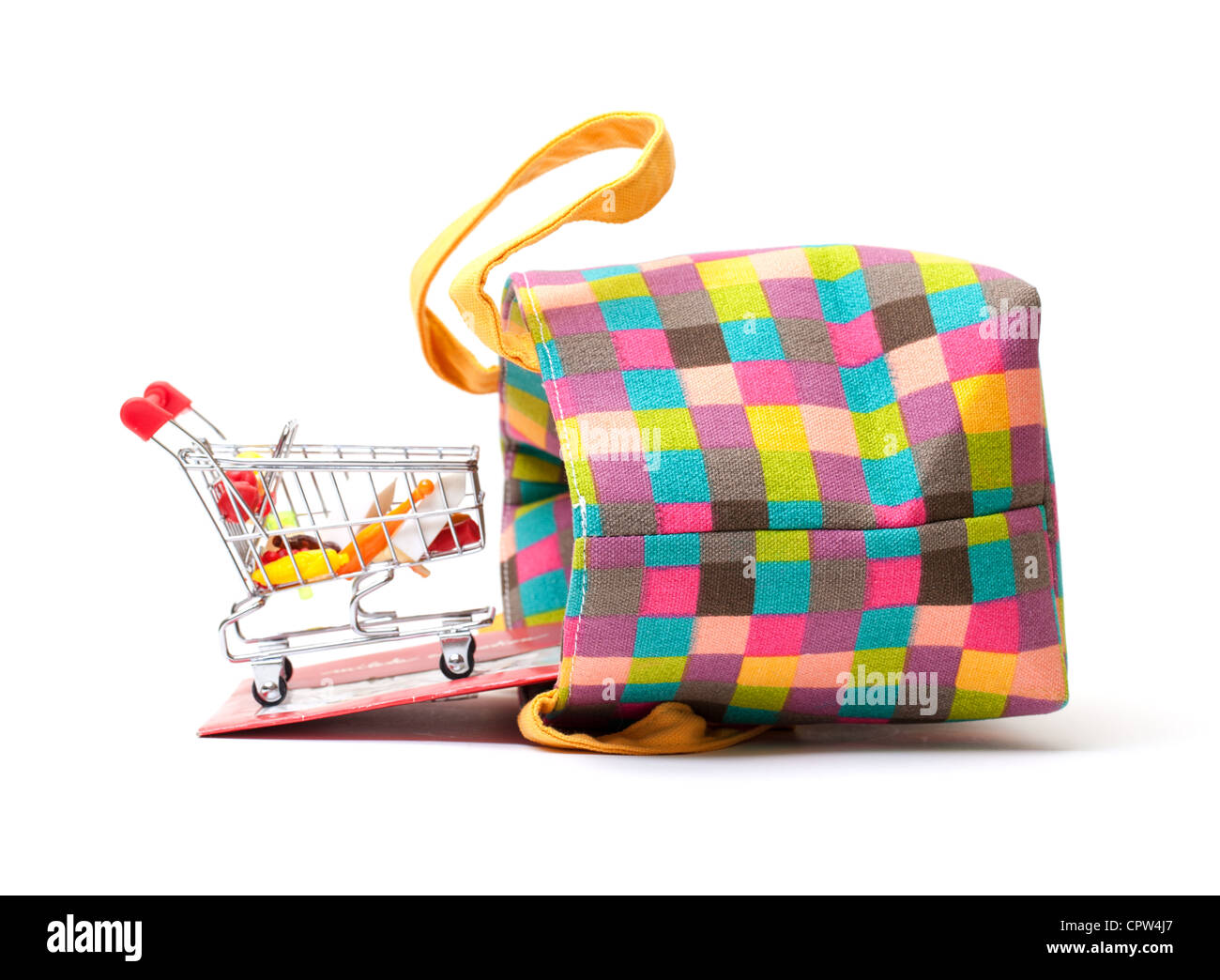 Shopping Cart with Vibrant Bag on white background Stock Photo
