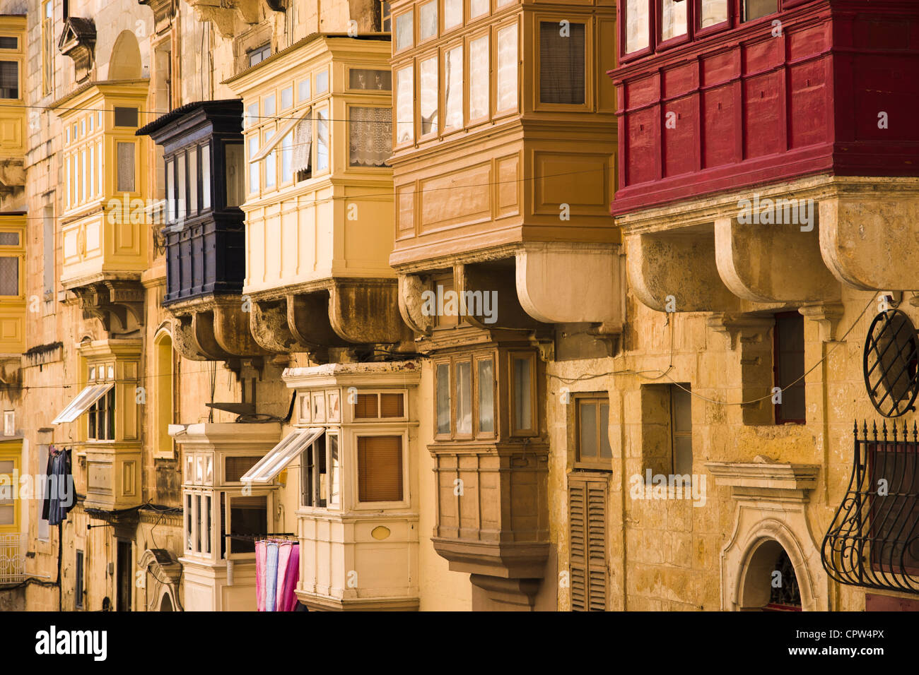 Traditional enclosed wooden balconies in Valletta, Malta. Stock Photo