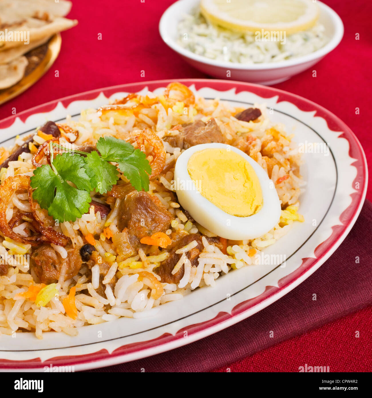 Special occasion Indian curry, lamb biryani with egg, coriander, and