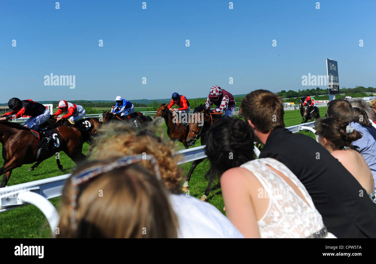 Spectators enjoy the finish of a horse race at Goodwood West Sussex UK Stock Photo