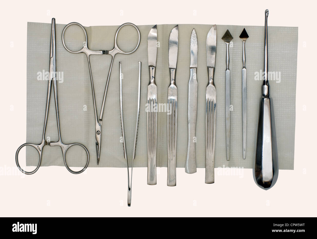Scalpels and a set of different surgical instruments on a napkin and a