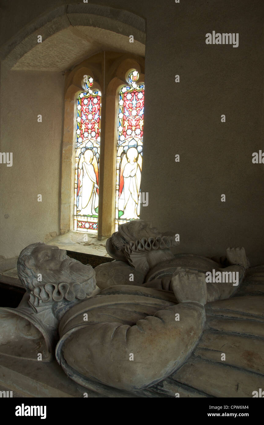 Two recumbent stone figures on the tomb of John and Anne Meller, in the Church of St Peter, at Winterborne Came in Dorset. England, United Kingdom. Stock Photo