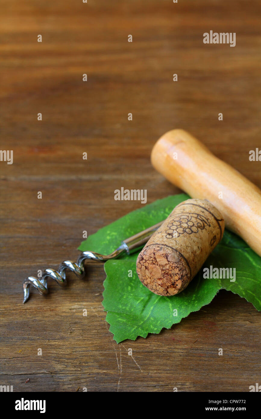 Corkscrews and corks on the  wooden background Stock Photo