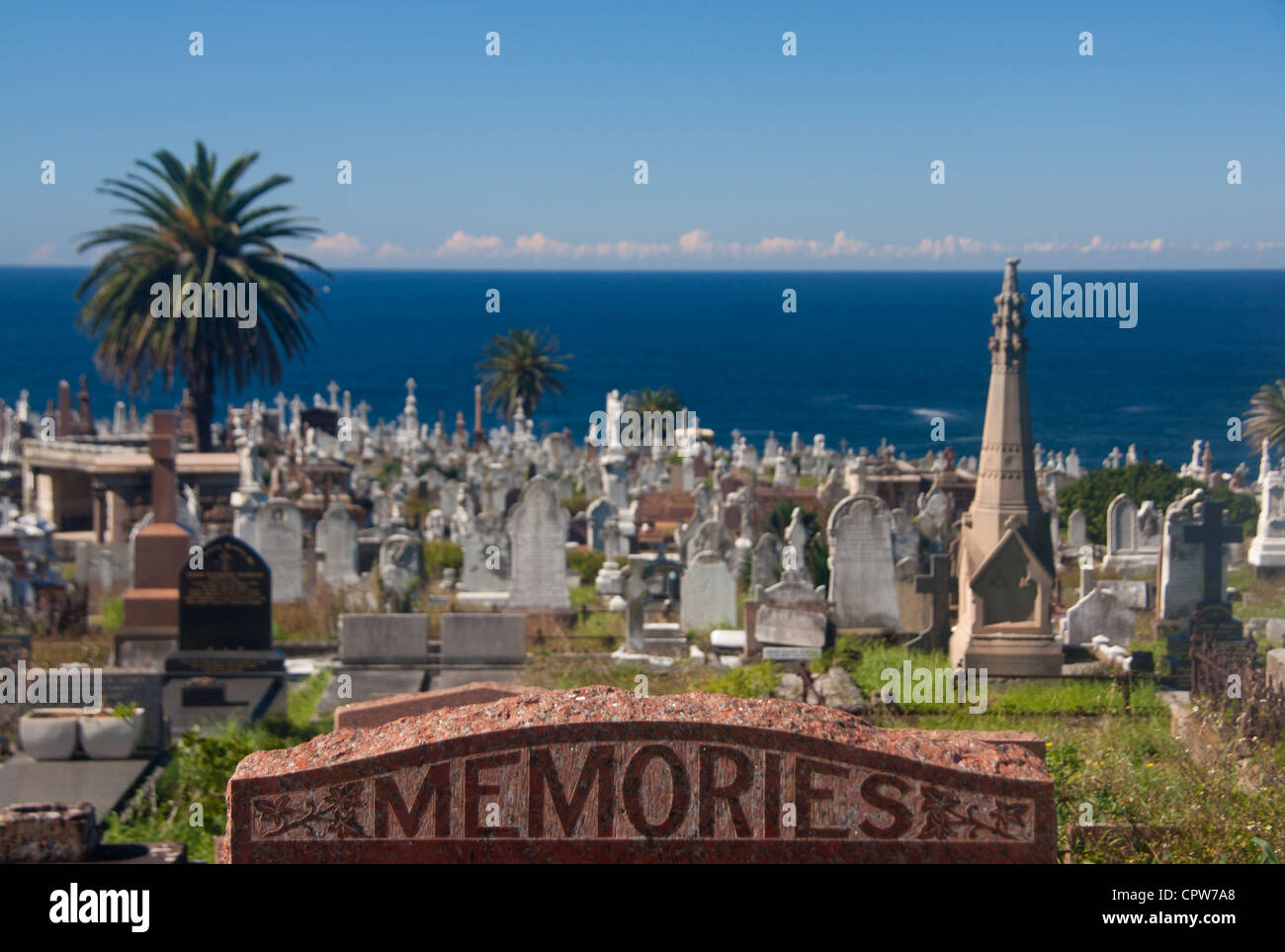 'Memories' inscription on gravestone with graves and Pacific Ocean in background Waverley Cemetery Sydney NSW Australia Stock Photo