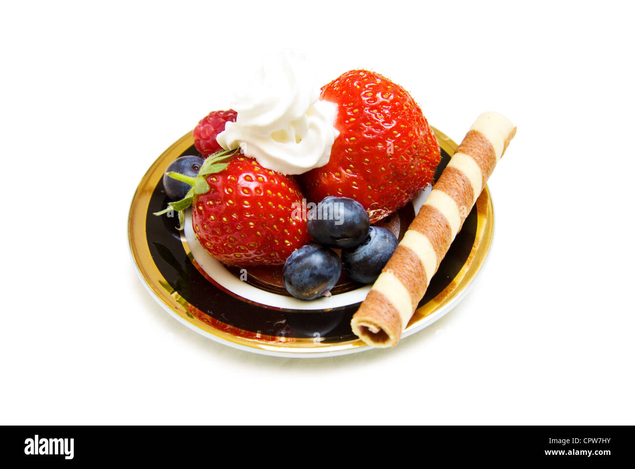 Healthy dessert with strawberry, raspberry and blueberries and chocolate waffle. Isolated over white background. Stock Photo