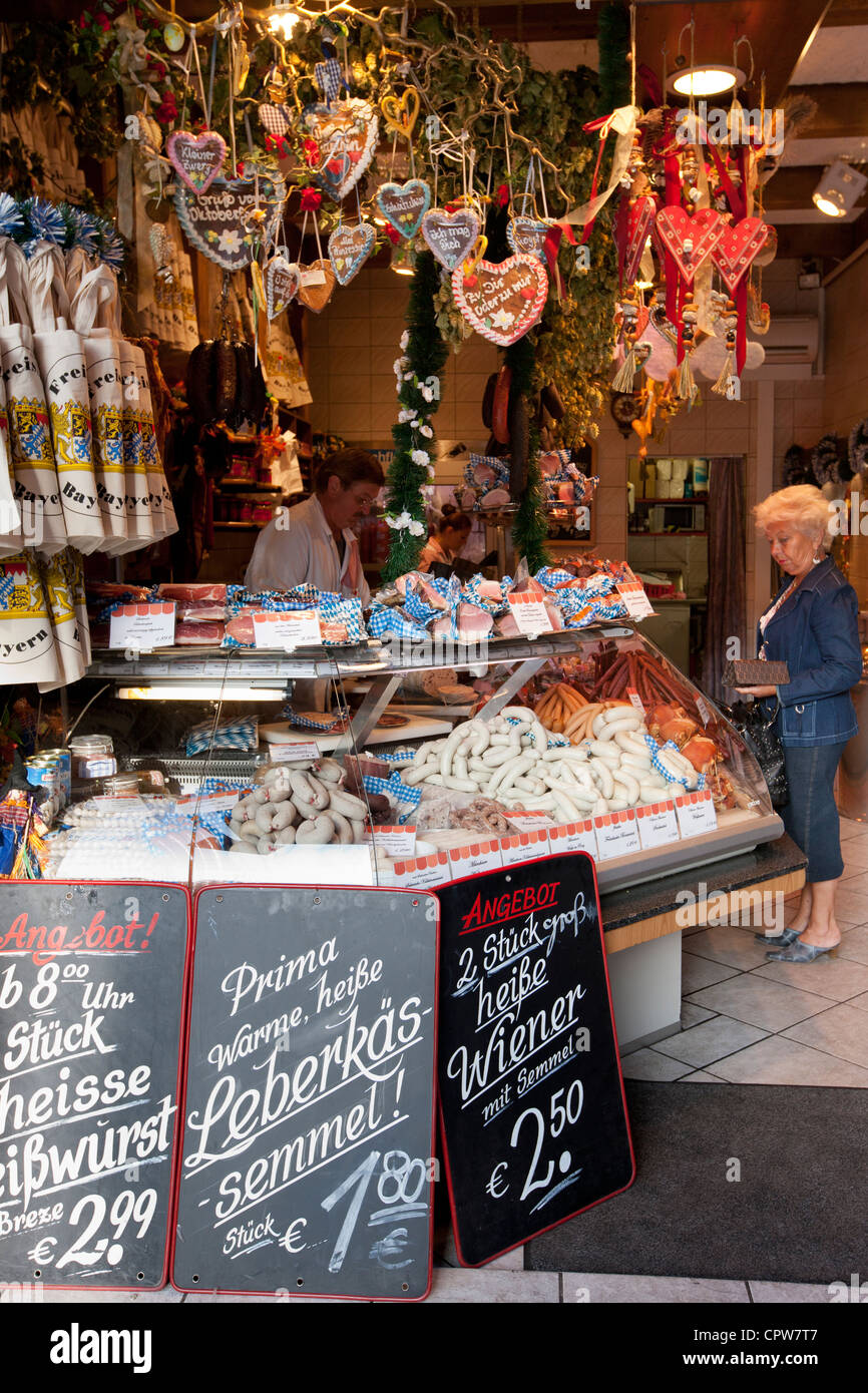 German sausages and souvenirs on sale in food market in Munich, Bavaria, Germany Stock Photo