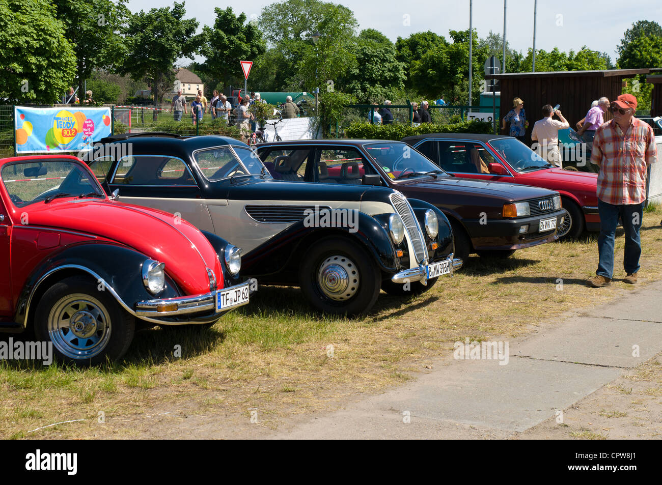 Old cars stand in a row, VW Beetle, BMW 340, AUDI 100 Stock Photo