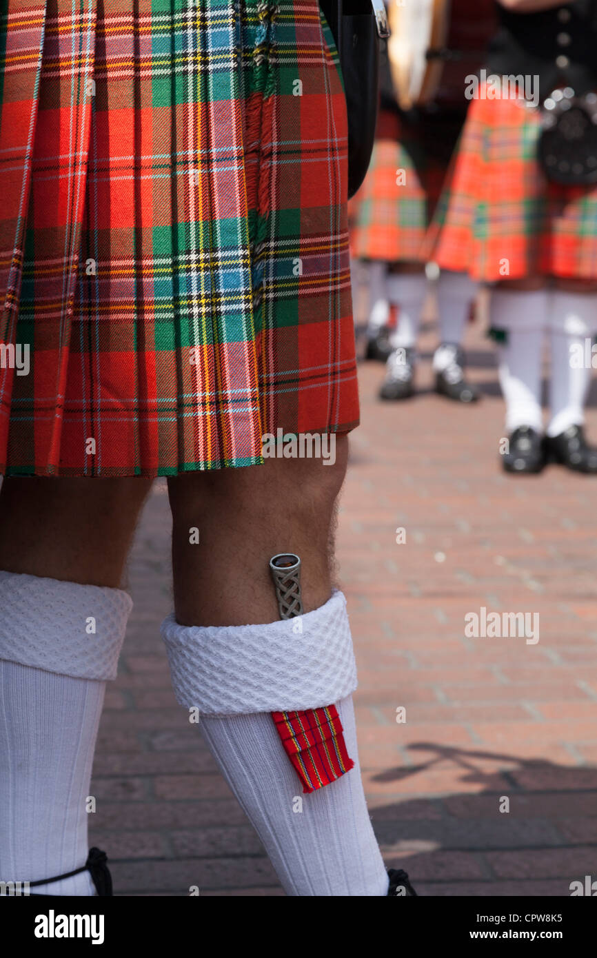 dirk in sock with kilt of scottish bagpipe player in Chichester diamond jubilee procession Stock Photo