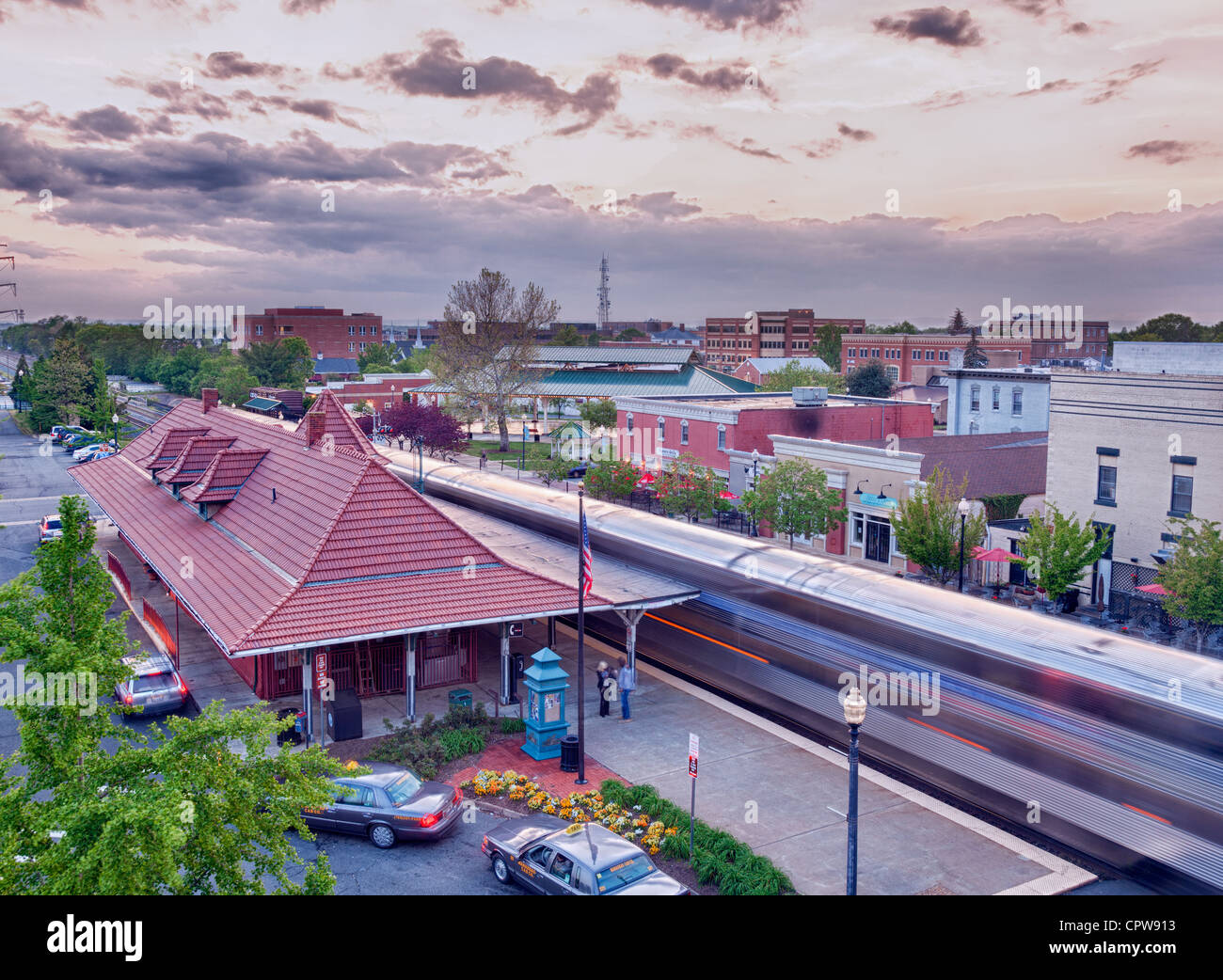 Manassas railway station at dusk or sunset as the Amtrak train rushes
