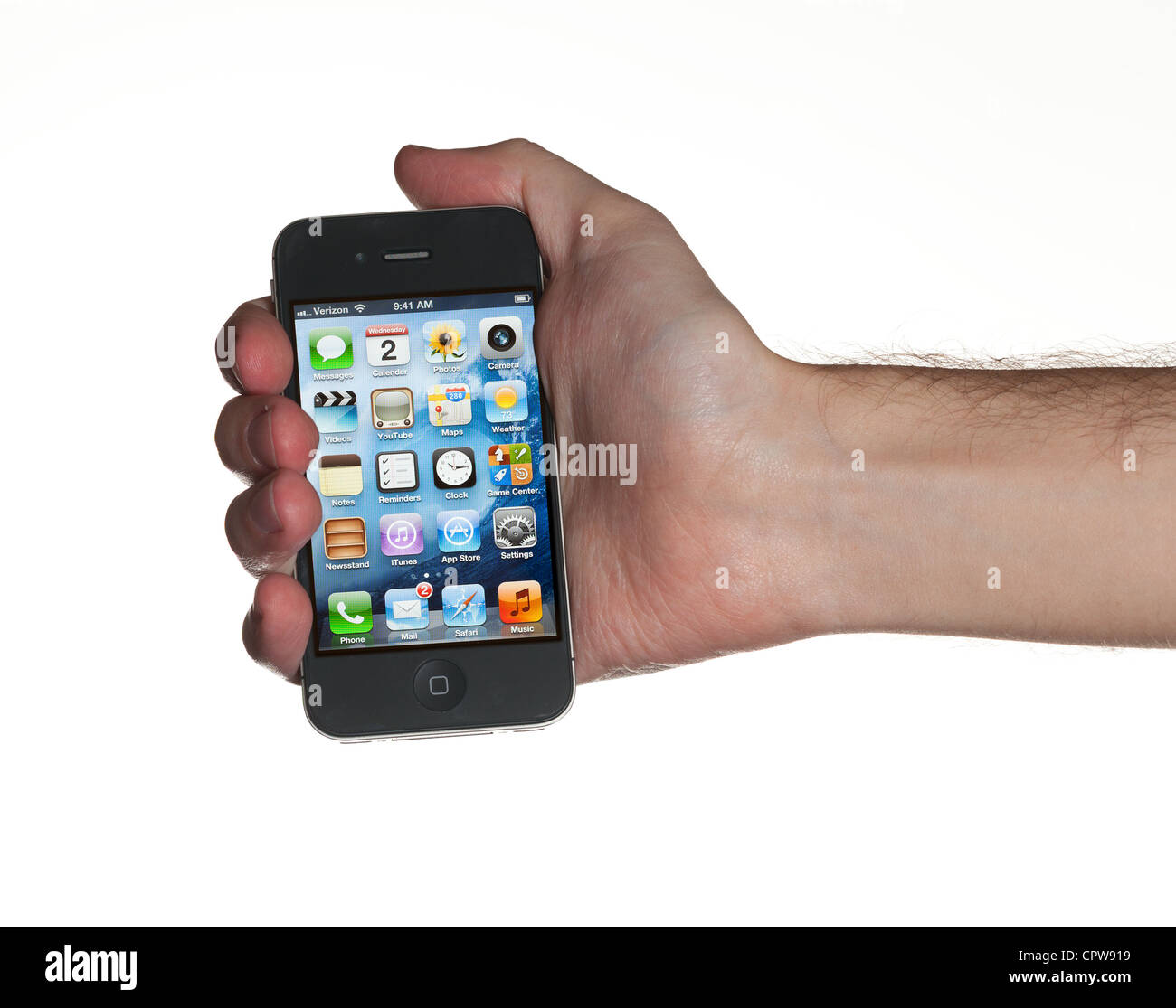 Washington DC - May 1, 2012. A hairy male hand holding an Apple iPhone 4S with Verizon wireless service Stock Photo