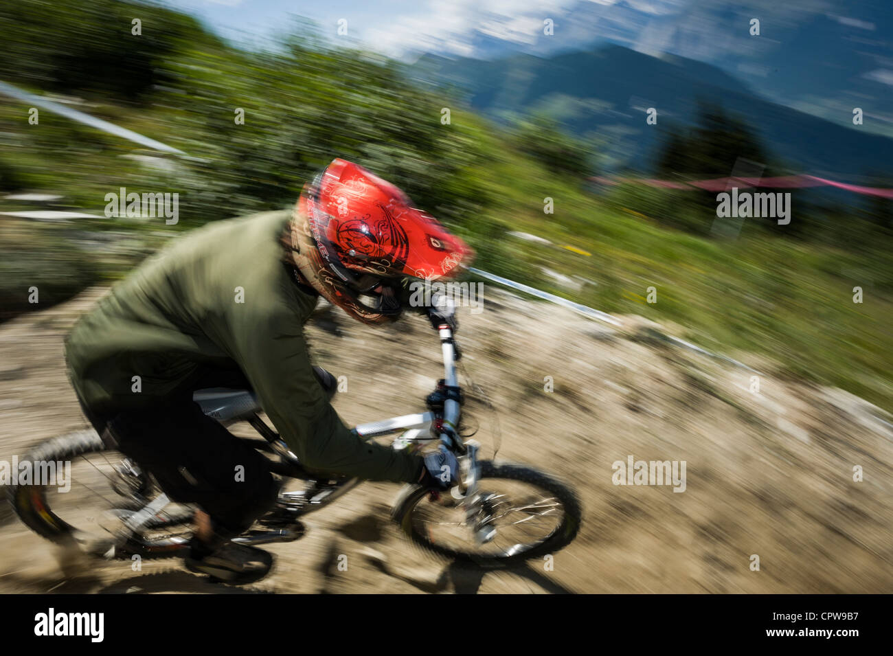 Downhill mountain biker high above Verbier, Swiss mountains, Switzerland Stock Photo